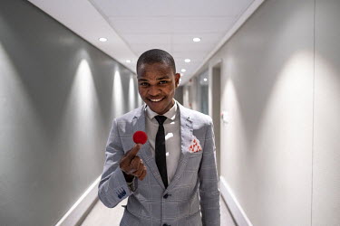 Illusionist Khanya Rubushe, a student of the Cape Town College of Magic, poses for a photo while preparing to perform an act at the Artscape Theatre.