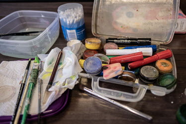 Facepaints lie on a table backstage during a performance by the Cape Town college of Magic at the Artscape Theatre.