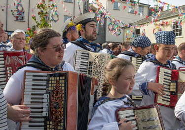 Revelers at the start of Padstow's annual festival on May 1st celebrating the approach of summer. Known as the 'Obby Oss' its origins are ancient and pagan. Today's participants are made up of locals...