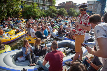 'Canalival', a flash mob event in London's East End, during which revelers launched inflatable dinghies and other home made watercraft into the Regent s Canal for a day long floating party. Advertised...
