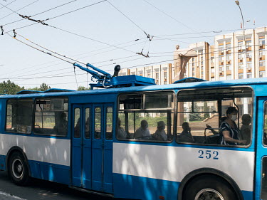 A trolleybus passes the Transnistrian Parliament in Tiraspol. Transnistria, officially part of Moldova, is an unrecognised breakaway state that unilaterally declared independence in 1991.