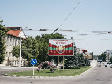 A billboard displaying the flag and crest of Transnistria stands on a street corner in Tiraspol. Transnistria, officially part of Moldova, is an unrecognised breakaway state that unilaterally declared...