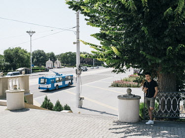 A trolleybus drives along a road in central Tiraspol.