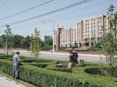 Workers trim hedeges in front of Transnistrian Parliament in Tiraspol. Transnistria, officially part of Moldova, is an unrecognised breakaway state that unilaterally declared independence in 1991.