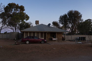 A house in Wilcannia with a car parked in front.