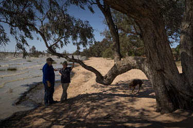 Phil Turner and his wife Marilyn "Maz" Turner go for a walk along the edge of Lake Pamamaroo with their dog, The couple has been isolating here for the last 3 weeks. Phil Turner, the owner of the Marr...
