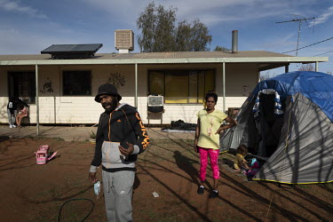 Ronnie Murray at the front of his home. He is part of a 10 person household in Wilcannia which has been forced to isolate in a small house. A tent was provided for Ronnie's brother to isolate in.