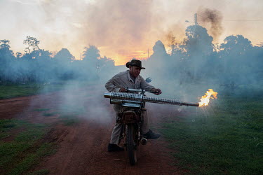 Cicero Xavier da Paz, an employee of the National Health Foundation of Brazil (FUNASA) uses smoke against a type of mosquito that spreads malaria in the quilombola (founded by escaped slaves) communit...