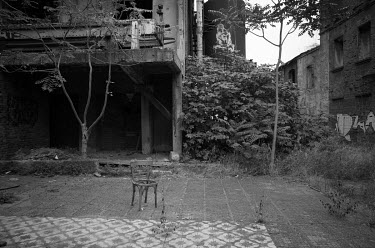 A chair left in the yard of the abandoned FIX brewery.