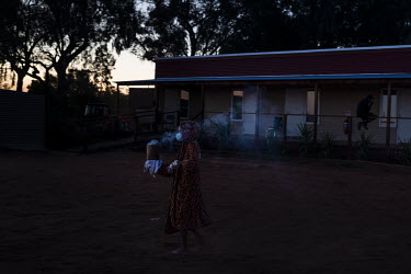 Patricia Wilson gathers eucalyptus leaves and other plants that she burns in a can to create a smoke that is a traditional Barkinji Aboriginal bush medicine and will help cleans the camp where she and...