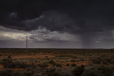 An afternoon storm rolls in kicking up dust across the dry landscape between Wilcannia and Broken Hill.