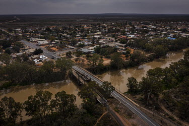 An aerial photo of the town of Wilcannia with the main road and Darling river bridge crossing.