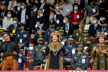 Members of some of Taiwan's indigenous aboriginal tribes perform a song in front of high ranking members of the Republic of China (ROC) military during National Day Parade for Year 110 (2021) of the R...