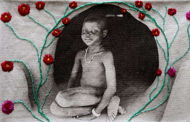 A photograph printed onto cotton and embroidered by the photographer.  A Dinka child in the doorway of a traditional home.