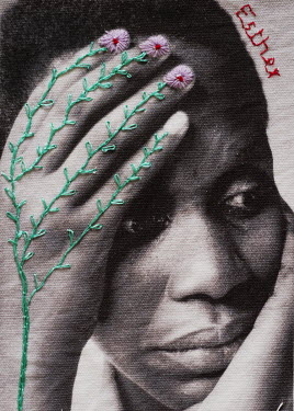 A photograph printed onto linen and embroidered by the photographer.   Esther, a widow who lost her husband during the genocide.