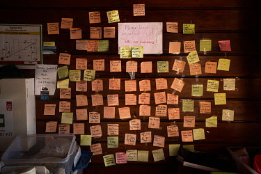 Handwritten messages from residents of Quaama stuck on a board to notify others whether they were safe or not shortly after the fires at the Quaama School of Arts which has been converted into a tempo...