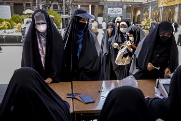 Women voting at a polling station installed in the mausoleum of Shahabolazim in the poor southern district of Sharevey for the 2021 presidential election.