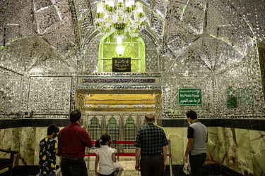 Visitors in the ornate mausoleum of Shahabolazim in the poor southern district of Sharevey.