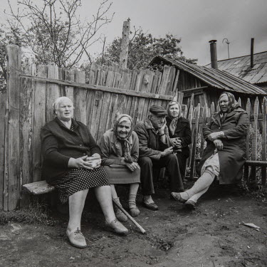 Pensioners discussing the state of things in the small village of Sotsialisticheskiy (Socialism) about 300 miles south of Moscow. 'The government has forgotten us, they don't give us our pensions even...