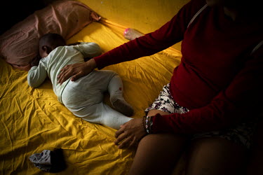 Ana (not her real name), a 26 year old Venezuelan migrant, puts her son to sleep in her room in the shelter for female victims of gender based violence. She arrived in Ecuador in 2018 and came to the...