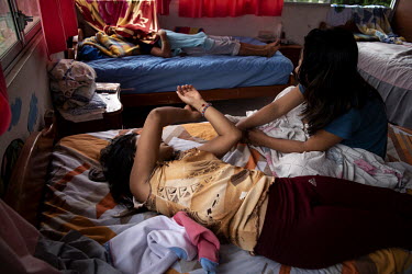 Cecilia and Silvana, not their real names, spend time together in their room at the shelter for women who have been victims of gender based violence in Lago Agrio. Lago Agrio is a border city between...