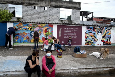 Psychologists, educators and teenagers from the community paint a mural about gender violence on a wall in Lago Agrio.   Lago Agrio is a border city between Ecuador and Colombia and has one of the hig...