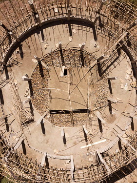 The structure of Kuskwam Mariam church during reconstruction reveals the circular outer wall and circular holy place which was often decorated in bright paintings. At the centre is the square holy of...