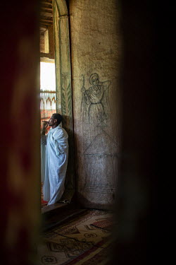 Narrative art paintings of battles and martyrdoms from Ethiopia's past in Betre Mariam church on the Zege peninsula, embellished with depictions of flora.