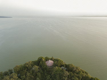 A full tree canopy on an island on Lake Tana. The trees are there because of the presence of sacred sites as well as the absence of subsistence farming.