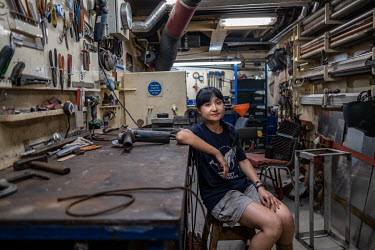 Deckhand Yei Hsuan Huang photographed in the technical space of the Greenpeace vessel Arctic Sunrise near the Seychelles.