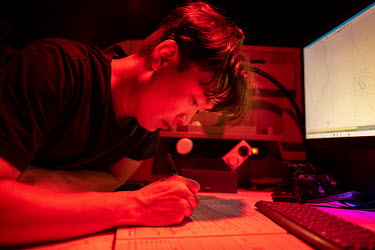 First mate on the Greenpeace vessel Arctic Sunrise, Yeonsik Kim, notes down coordinates during a visit to the Saya de Malha Bank in the Indian Ocean.