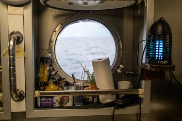 A porthole in the galley of the Greenpeace vessel Arctic Sunrise.