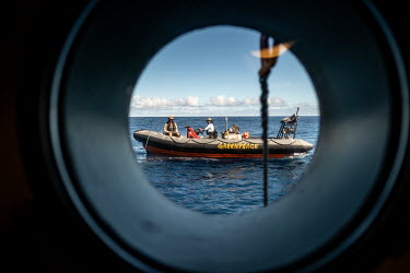 A RHIB through a porthole on the Greenpeace vessel Arctic Sunrise.