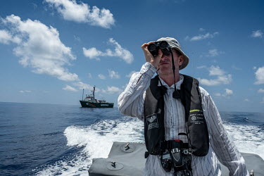 Marine acoustician Tim Lewis searches for sperm whales near the Seychelles.