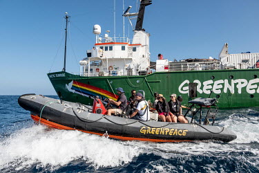 Climate activist Shaama Sandooyea and Greenpeace staff search for shallow areas on the Saya de Malha bank in the Indian Ocean ahead of performing an underwater climate protest.