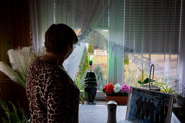 Maria Ancipiuk in her home by a green light, a signal for the migrants that they can get help here. Thousands of migrants attempted to cross into Europe along the Poland Belarus border in the autumn o...