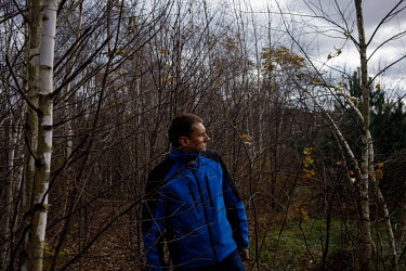 Stanislaw Sadkowski, a farmer, walks in forest near the border with Belarus. Stanislaw lives inside the state of emergency zone, set up by Poland on the border.  The zone is a response to a significan...