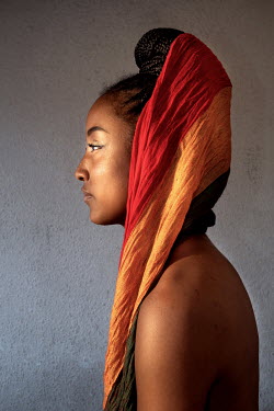 Katherine Ramos, 23, a member of the pan African activist group Addis Ababa, keeps alive the traditions her grandmothers taught her on the use of turbans. She wears hers as a loose crown.