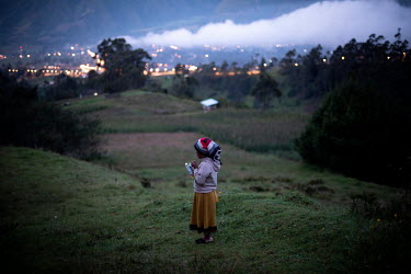Sayana Cuasque (6) looks at the sunset outside her community in San Clemente. Sayana returned to her community because her parents lost their job during the COVID-19 pandemic, and she and her brother...