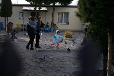 Polish volunteers playing with children of migrants, who crossed the border from Belarus, at the centre for migrants in Bialystok. The town is situated near the state of emergency zone by the Belaruss...