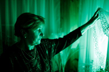 Maria Ancipiuk at her house, by the green lit window, a signal for migrants who need help in Michalowo. The town is situated near the state of emergency zone by the Belarussian border. Hundreds of mig...