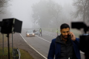 Al Jazeera journalist by the roadblock at the state of emergency zone by the Belarussian border near Sokolka. Hundreds of migrants, mainly from Syria, Iraq and Afghanistan are stuck on both sides of t...