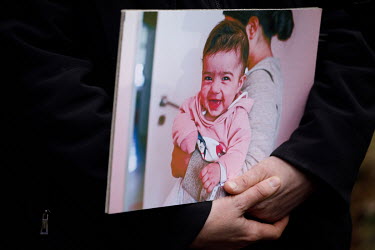 A man holds a photo of a mother and child during the press conference near the state of emergency zone by the Belarussian border near Sokolka. Hundreds of migrants, mainly from Syria, Iraq and Afghani...