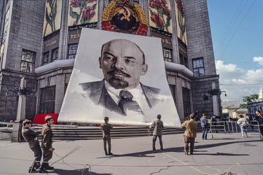 Lowering a giant banner of Lenin for the last time from the front of Moscow's central telephone office in 1991, the final year of the Soviet Union.