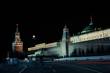 A full moon shines down on the Kremlin and a Soviet flag hangs limply above it in the last year of the Soviet Union's existence.