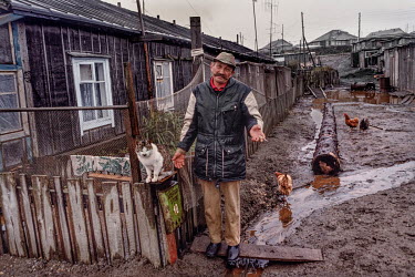 A man and his cat in the village of Yuzhno Kurilsk, one of the Soviet Union's most far flung locations, more than 4,000 miles and 10 time zones from Moscow but only about 40 miles from Japan's norther...