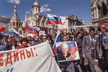 Demonstrators who support Boris Yeltsin enter Red Square during the struggle between those who supported the Russian president's free market reforms, going beyond what Gorbachev had proposed and the C...
