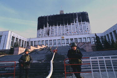 Soldiers guarding the entrance to the burned out Russian Parliament (White House) on 04 Oct 1993, the day after Yeltsin ordered tanks to fire on his own parliament which had been seized by pro Communi...