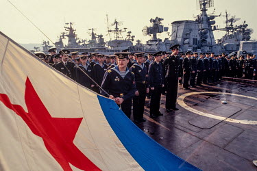 A flag ceremony on the deck of a Black Sea fleet naval vessel. Up to 1991 Russian and Ukrainian naval forces cooperated with each other but after the break up of the Soviet Union control of Sevastopol...