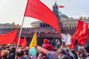 General Secretary of the Communist Party Mikhail Gorbachev and other Communist Party elite greet crowds on Red Square from the top of Lenin's mausoleum on May Day 1991. The Soviet flag flying over the...